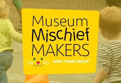 Kids running around the courtyard at Petersfield Museum and Art Gallery with bright yellow Mischief Maker logo