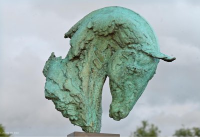 Bronze statue of a horse head.