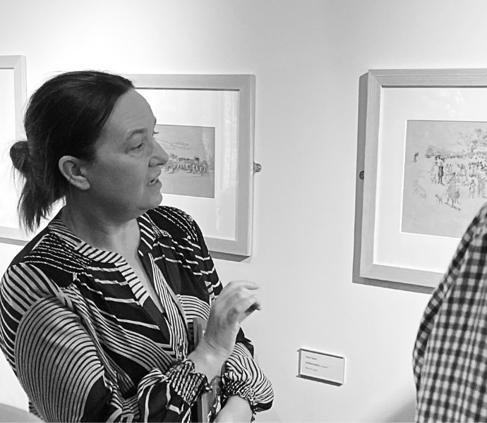 Louise Weller, Head of Collections and Exhibitions is leading a group of guests around the Petersfield Gallery.