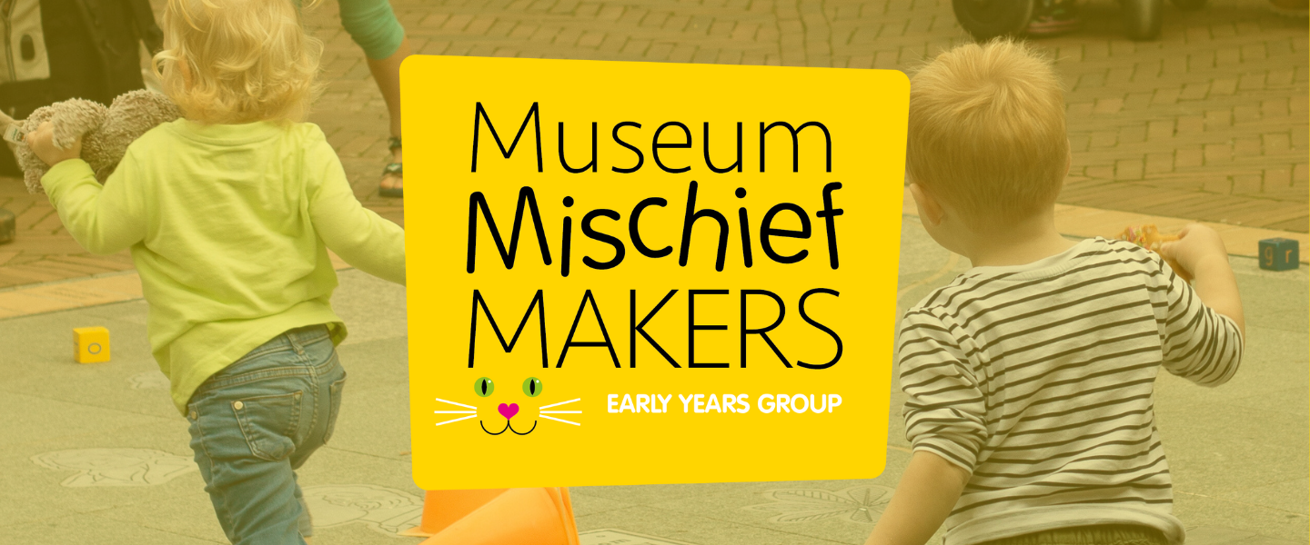 Kids running around the courtyard at Petersfield Museum and Art Gallery with bright yellow Mischief Maker logo