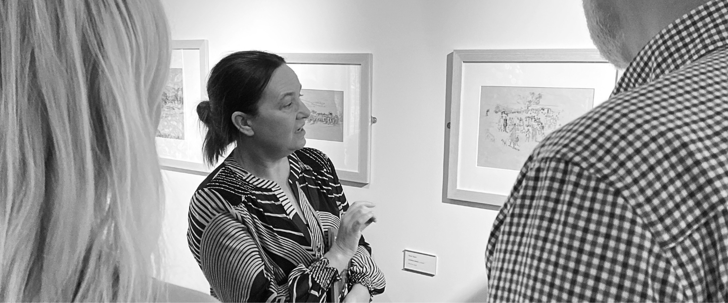 Louise Weller, Head of Collections and Exhibitions is leading a group of guests around the Petersfield Gallery.