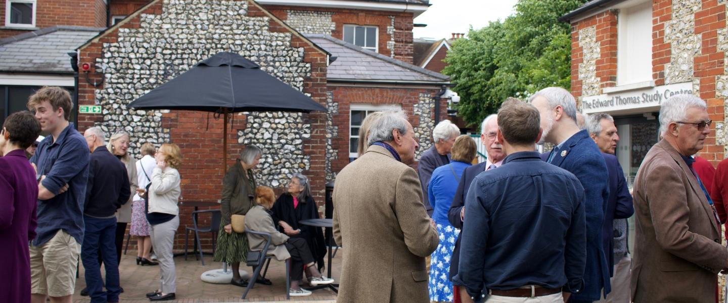 Groups of people talking in the courtyard of Petersfield Museum and Art Gallery