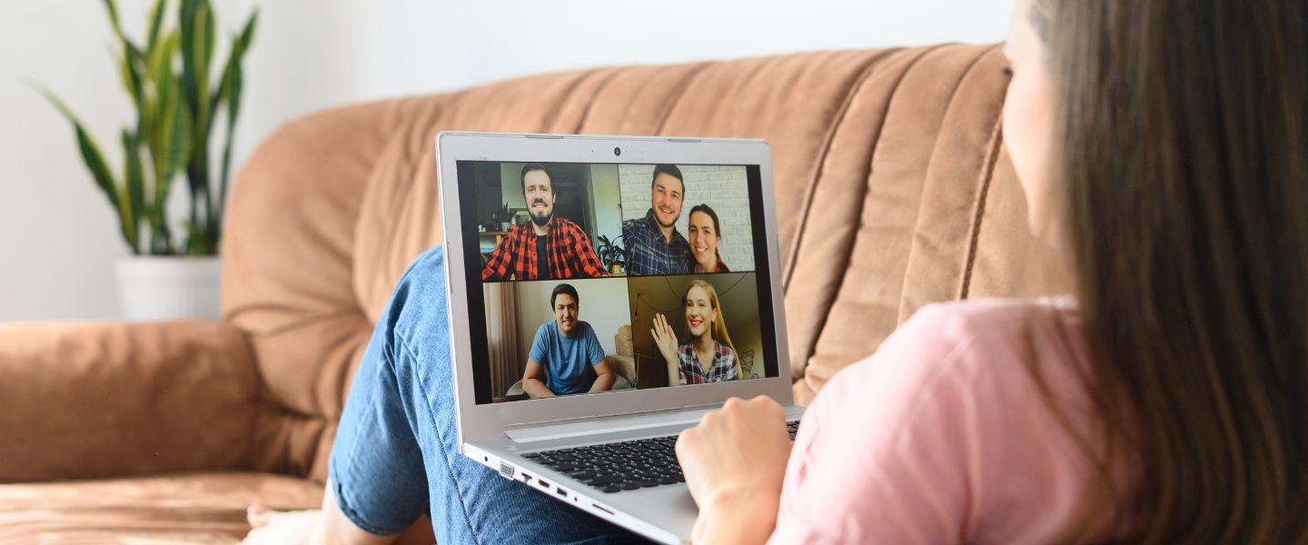 Woman sat on computer on a Zoom call.